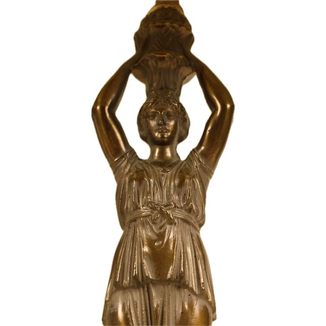 striking pair of vintage bronze-finished caryatid figural table lamps manufactured by Alsy. Combining classical grandeur...