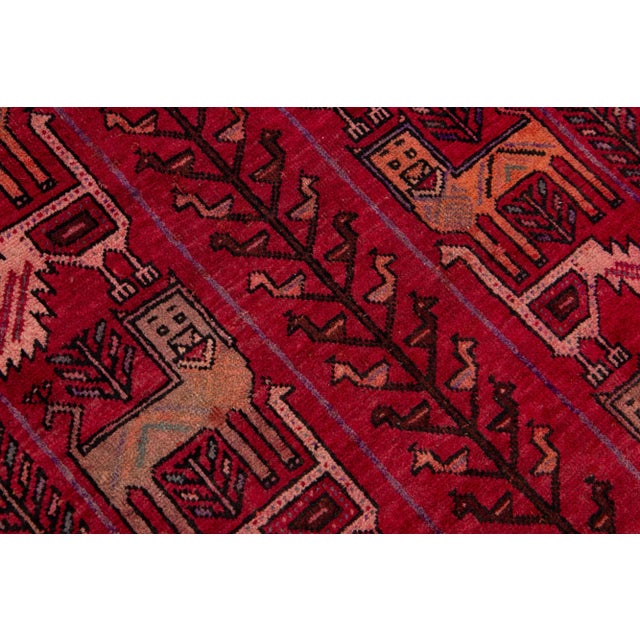 Beautiful vintage Persian Shiraz hand-knotted wool rug with a red field. This piece has multicolor accents in an all-over...