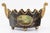 A gorgeous gilded antique French Neoclassical style black and gold toleware monteith cachepot. This fine jardiniere has a...