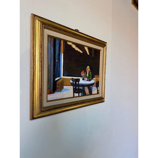 A charming vintage figurative oil painting by artist Florence Zevich, depicting an intimate interior café scene rendered...