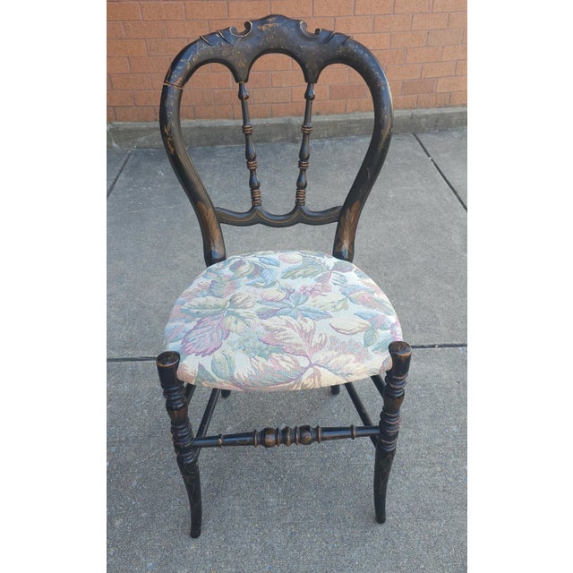 A 19th Century Victorian Ebonized, Decorated and Upholstered Side Chair measuring 16.5" in width, 19" in depth and...