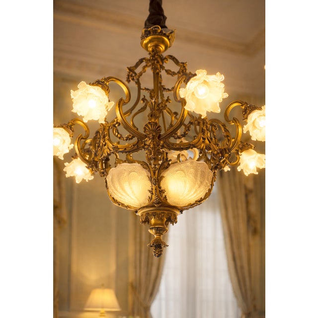 19th Century French Louis XVI Gilt Bronze & Milk Glass Chandelier A beautiful 19th century French chandelier dating to...