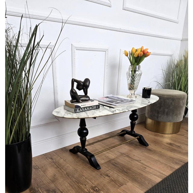 Very charming and elegant small Italian side coffee table with stylish carved shaped legs in solid wood and completed by...