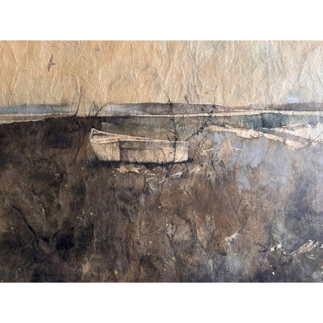 Original watercolor by Charles Colombo (American, 1927-2015), depicting a beached rowboat on a quiet marshy shore, signed...