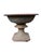 Pair of monumental cast iron garden irons with foliate and grape design on the basin flowing to an elegant scalloped...