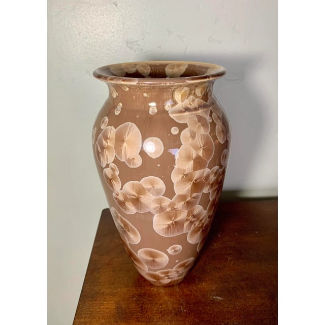 The unusual exploding glaze technique called “fish scale glaze” makes this medium size brown vase by Jon Buie a great...