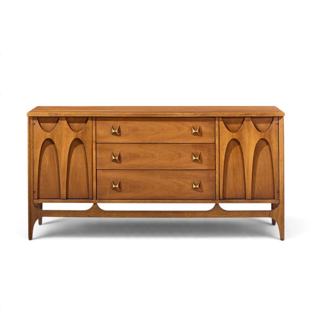 Broyhill Brasilia Mid Century Walnut and Brass Credenza This credenza measures: 56 wide x 17 deep x 28 inches high Good...