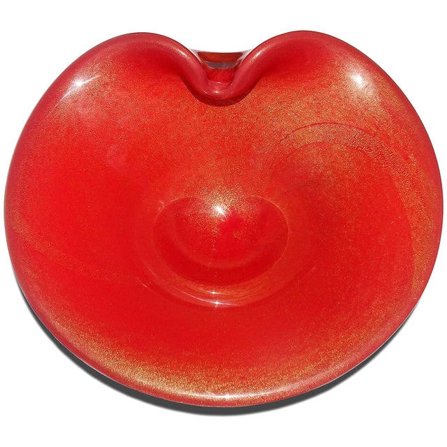 Beautiful vintage Murano hand blown rich persimmon orange and gold flecks Italian art glass decorative bowl. Created in...