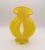 A striking hand-blown art glass vase in saturated canary yellow, featuring a voluptuous sculptural form and beautifully...