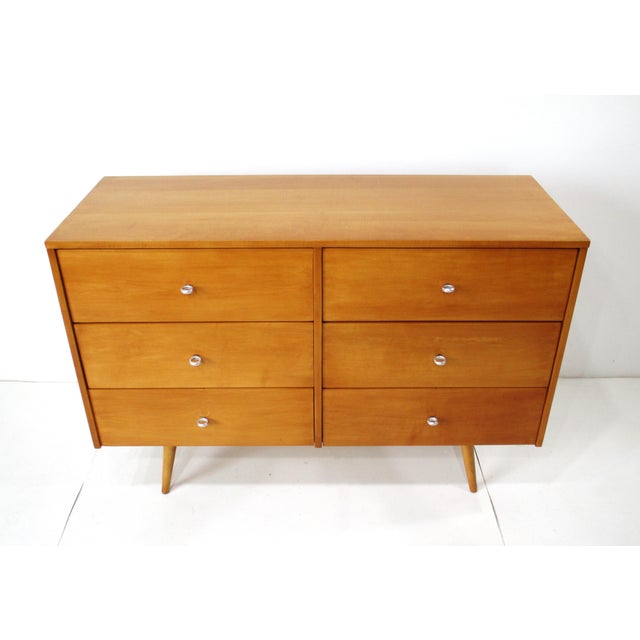A very well-crafted solid maple wood six drawer dresser chest with unique machined aluminum ring styled pulls. Sitting on...