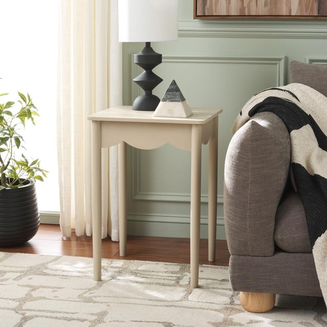 Enhance your home with the Paislynn Accent Table in a tranquil Sand color. This elegant table features a versatile design...