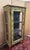Venetian-style painted wooden display cabinet Three glass sides Decorated with ribboned foliage Spindle legs