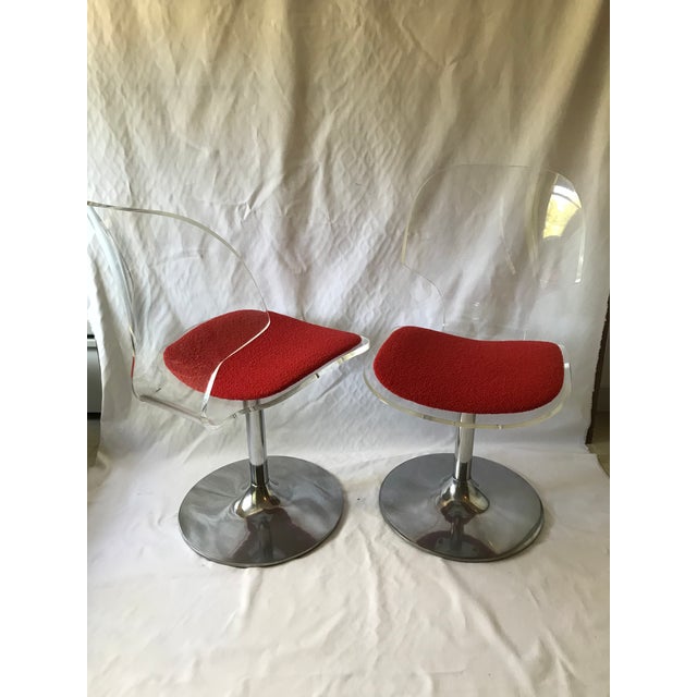 Pair of awesome retro mid-century modern swivel chairs with shaped lucite backs with raise upholstered seat. These chairs...