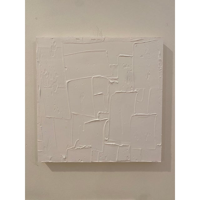 Acrylic and joint compound on cradled wood panel, 12 x 12 x .75. Edges painted white, back wired, ready to hang.