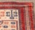 Turkish Baluch Wool Rug, in cream, red and navy blue. 5' 8" L x 3' 4" W. Provenance: From a 45 East 62nd Street Collection.