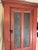 A nice 19th century New England primitive Pine two door Chimney Cupboard in old red paint over the original Salmon color....