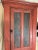 A nice 19th century New England primitive Pine two door Cupboard in old red paint over the original Salmon color. Through...