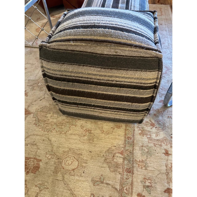 Great looking pair of Lee Industry poufs having heavy weight striped upholstery in various shades of grey. Very comfy...
