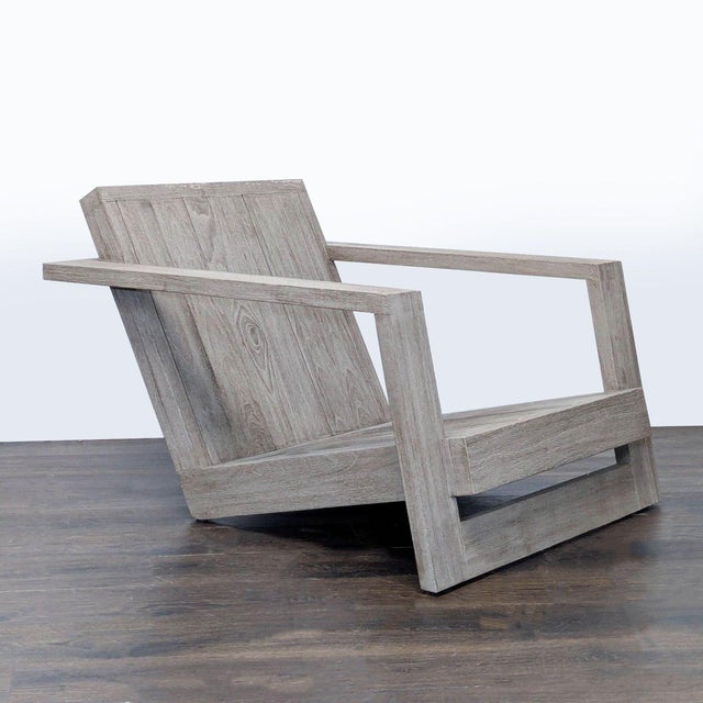 This modern chair features a sturdy teak frame with a stylish weathered finish. The wide armrests and inclined back...