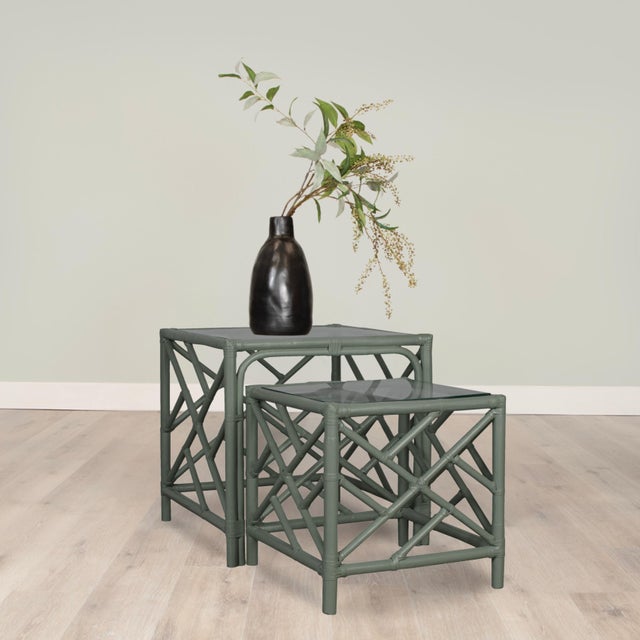 This exquisite set of rattan nesting tables blends classic chinoiserie charm with modern sophistication. Crafted with a...