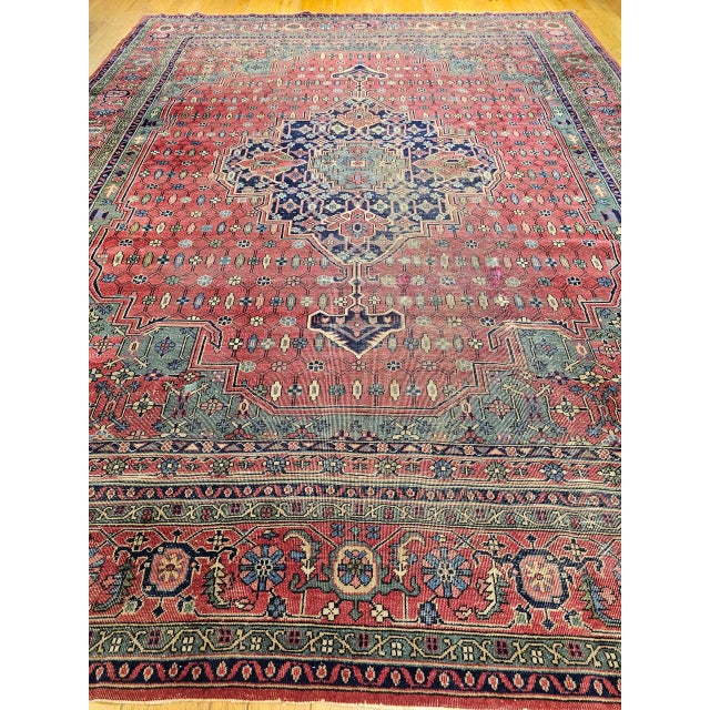 "This striking vintage Turkish rug, hand-knotted in a classic Persian Heriz medallion pattern, offers a bold geometric...