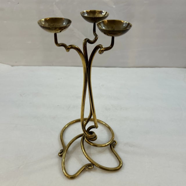 Vintage Joe Spoon Hand Wrought Brass 3 Arm Candle Holder Signed and Dated 1995. The design is clever and attractive with a...