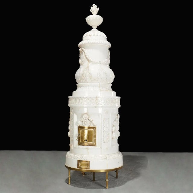 Monumental Austrian or Swedish White Glazed Terracotta Stove. Cylindrical form with laurel swags and wreaths, guilloche...