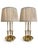 A stunning pair of vintage brass bouillotte table lamps featuring a classic 3-arm candelabra design with faux candles....