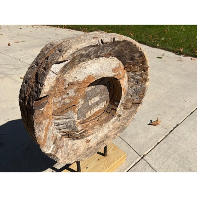 This vintage wooden spice or grain wheel is belived to be connected with early illing machinery. It serves now as a...