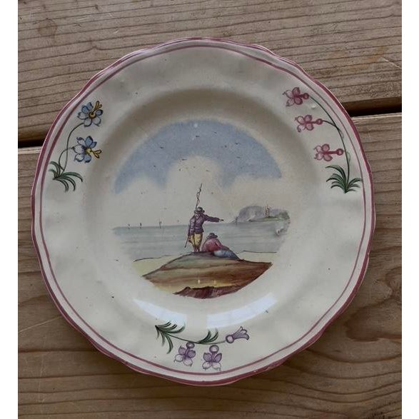 Set of 7 vintage 18th to early 19th century hand painted Veuve Perrin of Marseilles plates. The plates feature various...