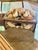 A charming antique wooden keepsake box beautifully adorned with an assortment of natural seashells, including cowries,...