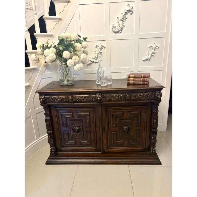 An impressive and richly carved Antique oak sideboard displaying strong late 19th-century craftsmanship and presence. The...