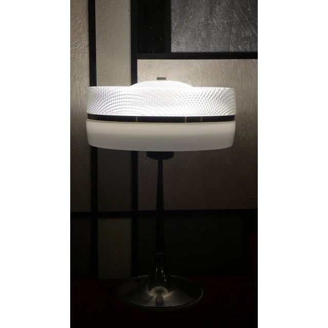 Rare example of futurist design for this lamp that celebrates the "Space Needle" skyscraper (literally space needle) of...