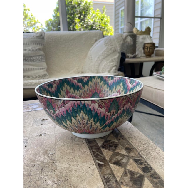 Indulge in the exotic allure of Macau craftsmanship with this captivating pastel peacock feather enamel porcelain bowl...