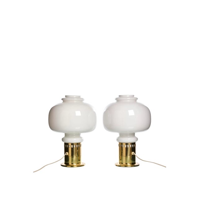 These table lamps, designed by Hans-Agne Jakobsson in the 1960s, feature a combination of brass and glass. The base is...