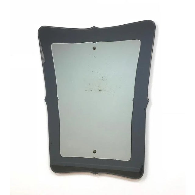 Unique and large Mid-Century double-layered wall mirror. It was produced in Italy during 1950s and it's clearly in the...