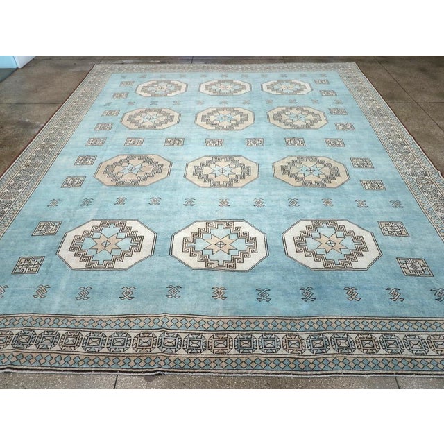 A vintage Turkish Oushak large room size carpet handmade during the Mid-20th century. Measures: 13' 2" x 15' 5"