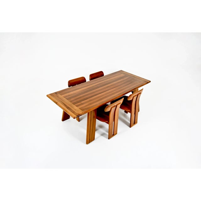 Dining room set consisting of four wooden and brown leather chairs and a wooden table from the Sapporo collection by Mario...