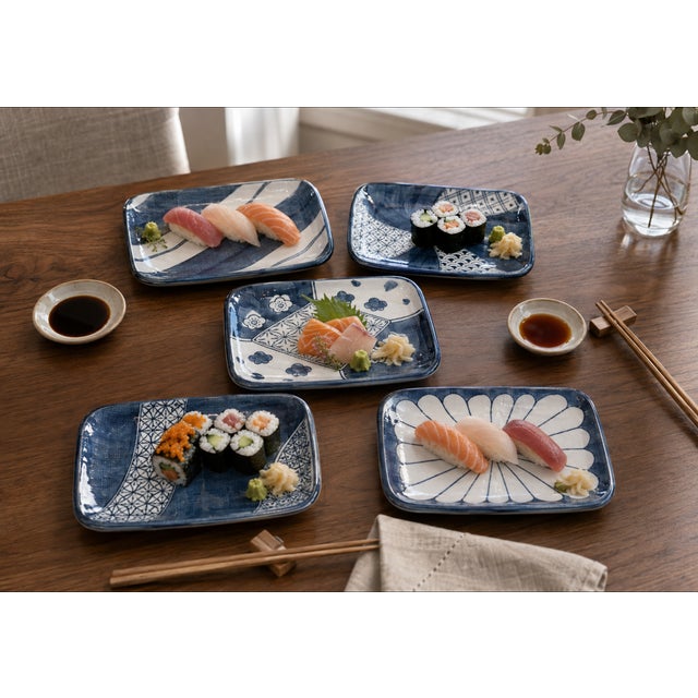 Circa 1980s Japanese blue-and-white ceramic sushi plates, made in Japan for Takahashi San Francisco. Each plate features a...