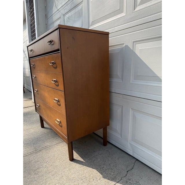 We have an absolutely beautiful, vintage Mid Century Modern walnut highboy dresser for sale. It has classic 1960s MCM...