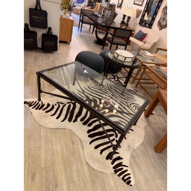 This is a stunning iron cocktail table by Charleston Forge. The frame is a heavy iron with twisted hammered detail and a...