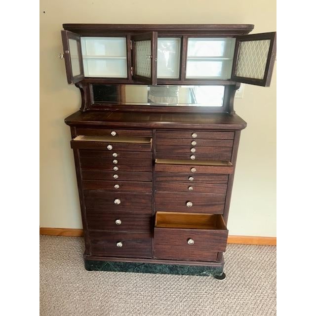 Antique early 20th Century mahogany dental cabinet with hutch featuring three frosted and raised diamond patterned glass...