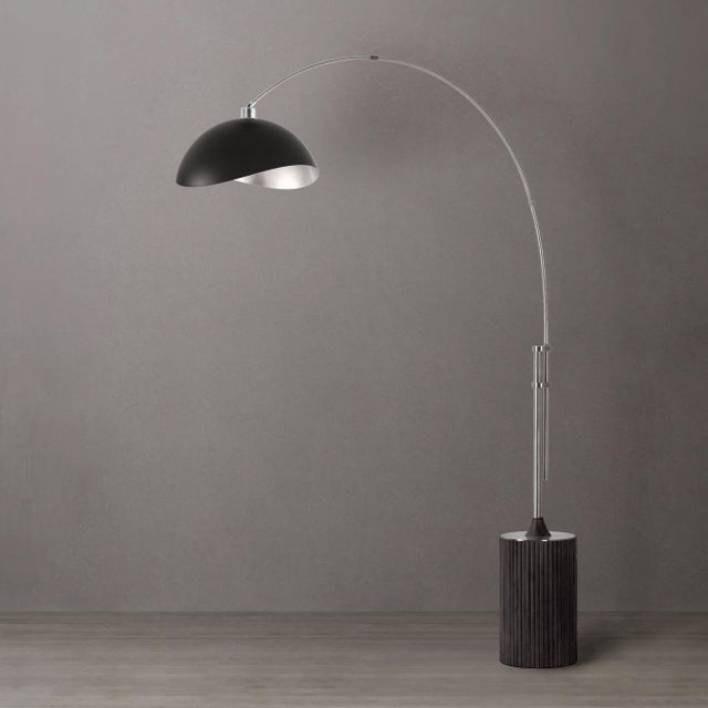 The Tambo Arc Lamp is a striking Mid-Century Modern lighting piece designed by Peter Morelli in 1984. This arc lamp...