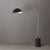 The Tambo Arc Lamp is a striking Mid-Century Modern lighting piece designed by Peter Morelli in 1984. This arc lamp...
