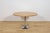 This dining table was manufactured in Denmark during the 1970s. The tabletop is crafted from oak wood. The table has...
