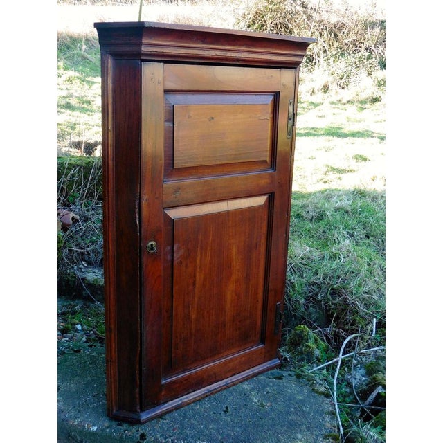 This is a rare piece, a 18th Century Corner Cupboard made in English cherry wood, much darker than the better known...