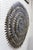 Hand-cut metal sun wall sculpture by Haitian artist Almann Ulysse (born 1945), crafted from recycled steel oil drums....
