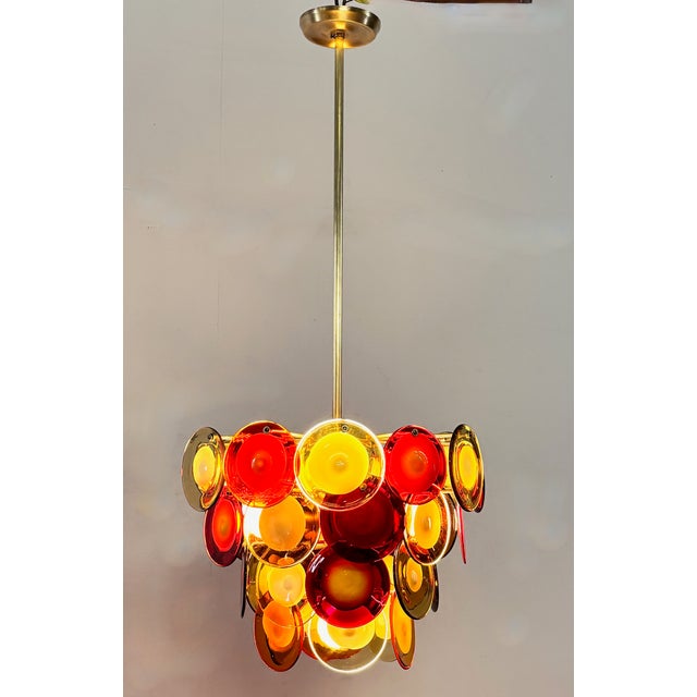 Vintage Italian Murano pendant chandelier with multi color blown glass discs. Recently cleaned and re-wired, and ready to...