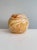 Handcrafted studio ceramic lidded box with a harmoniously rounded body and lid. The surface features an expressive glaze...