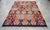 Vibrant Turkish Kilim Rug, 1966 Dated Vintage Tribal Rug, Pink and Orange Geometric Flatweave 6x8 Ft Approx For Sale - Image 17 of 18